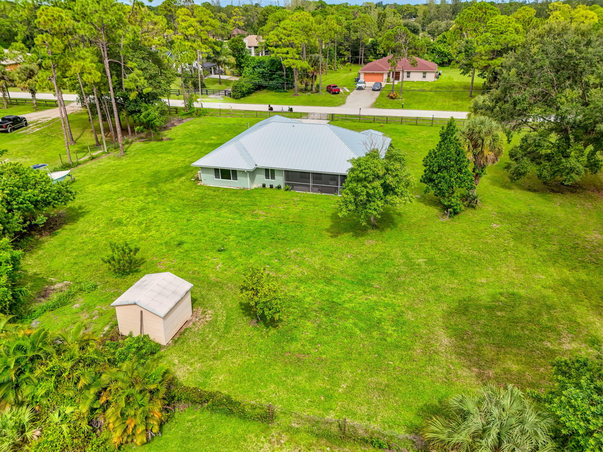 14366 76th Road North The Acreage, FL 33470 - Photo 76 of 76 a view of a house with a yard