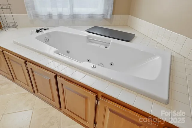 a bathroom with a bathtub and sink