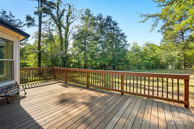 a view of deck with wooden floor and outdoor seating