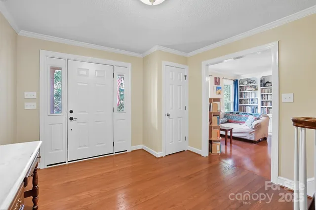 a view of a livingroom with furniture and hardwood floor