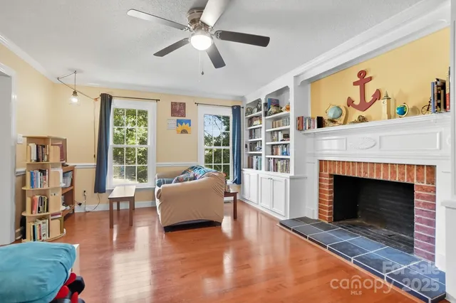 a living room with furniture and a fireplace