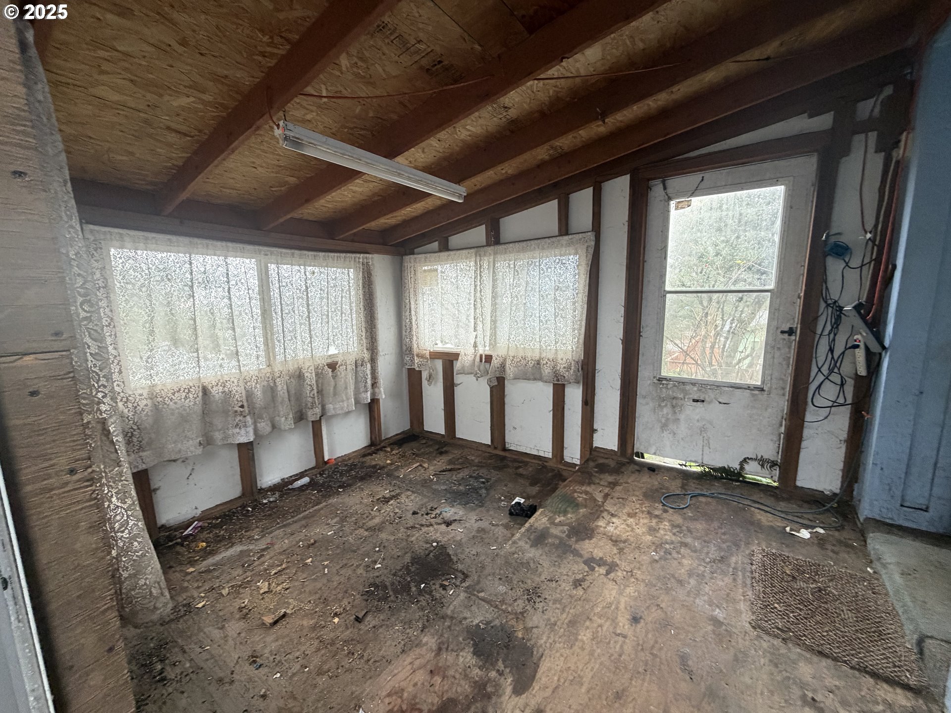 252 Northwest 20th Street Newport, OR 97365 - Photo 11 of 15 a view of an empty room with a window