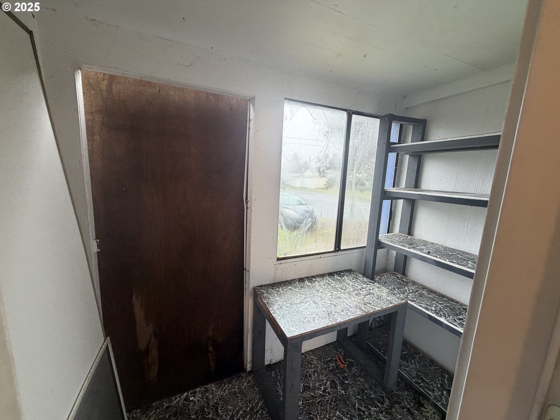 252 Northwest 20th Street Newport, OR 97365 - Photo 7 of 15 a view of a room that has a bed and a window in it