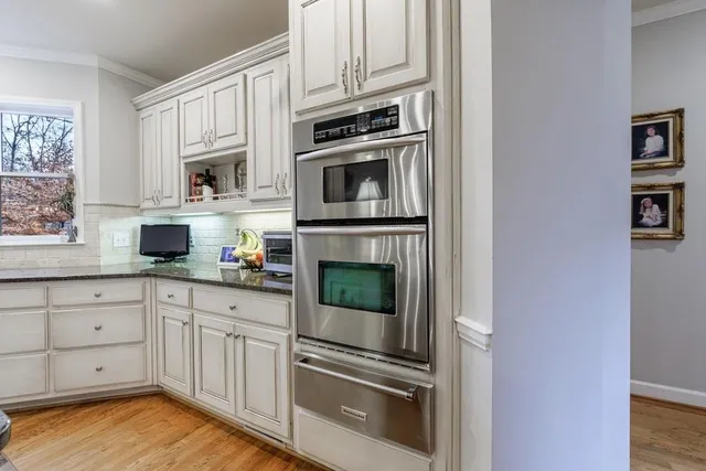 a living room with furniture fireplace and flat screen tv