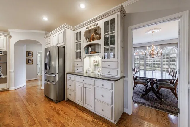 a living room with furniture a fireplace and a window