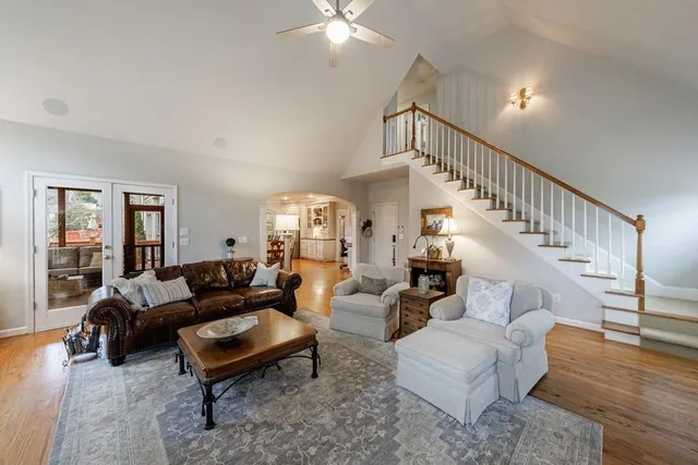 a view of a patio with chairs next to a yard