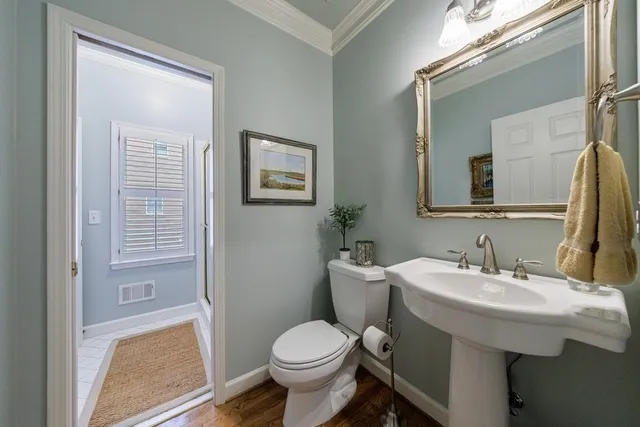 a spacious bathroom with a double vanity sink a mirror a bathtub and a shower