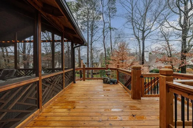 a bathroom with a toilet a sink a mirror a bathtub and vanity