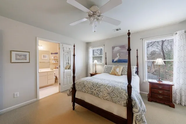 an aerial view of house with yard and mountain view in back