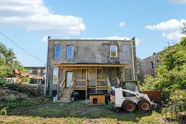 a house view with a sitting space and garden space