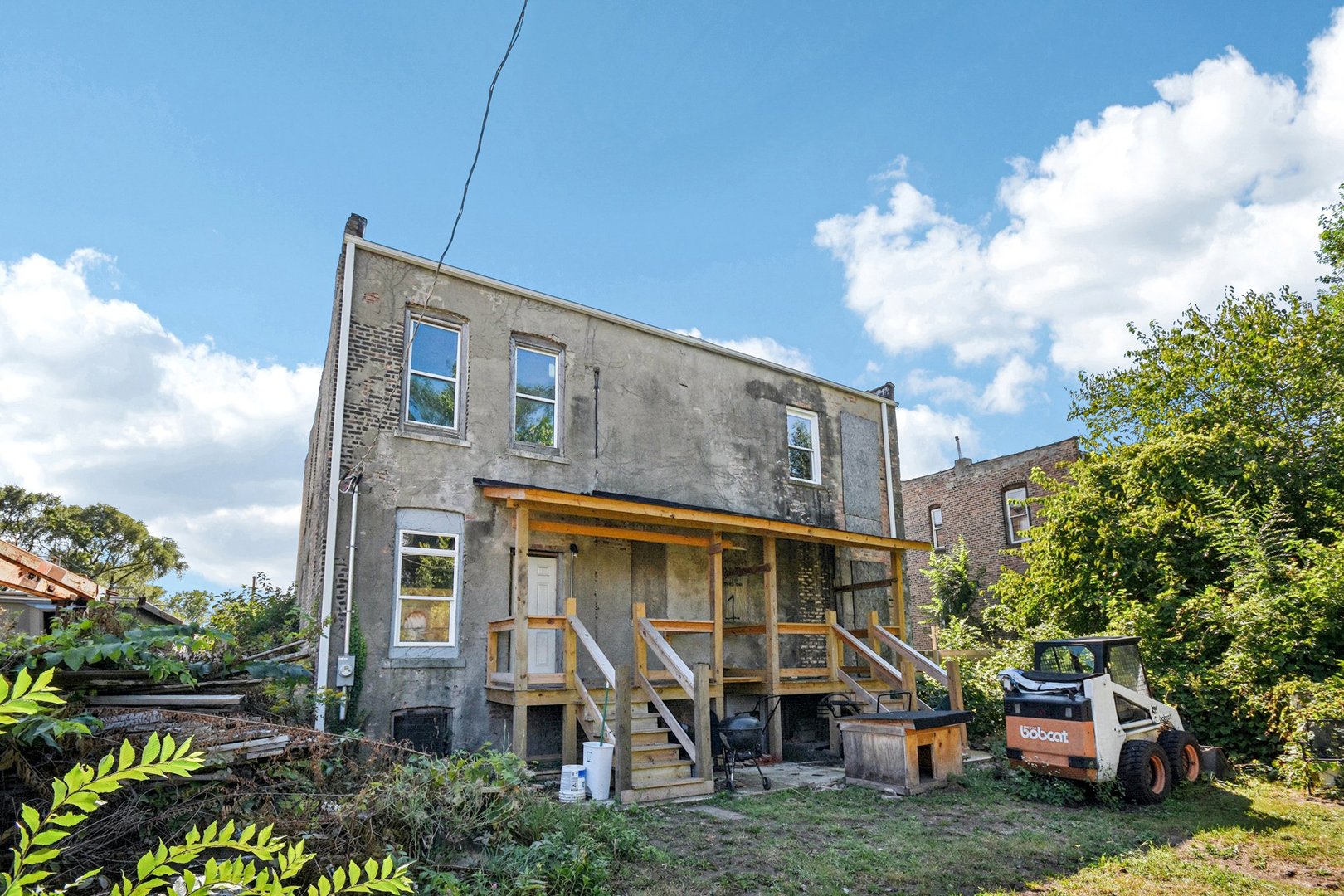 420 West 65th Place Chicago, IL 60621 - Photo 19 of 45 a front view of a house with garden