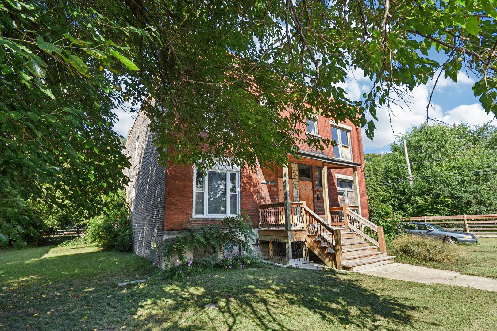 420 West 65th Place Chicago, IL 60621 - Photo 2 of 45 a view of a house with a yard