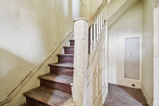 a view of a livingroom with furniture and a window