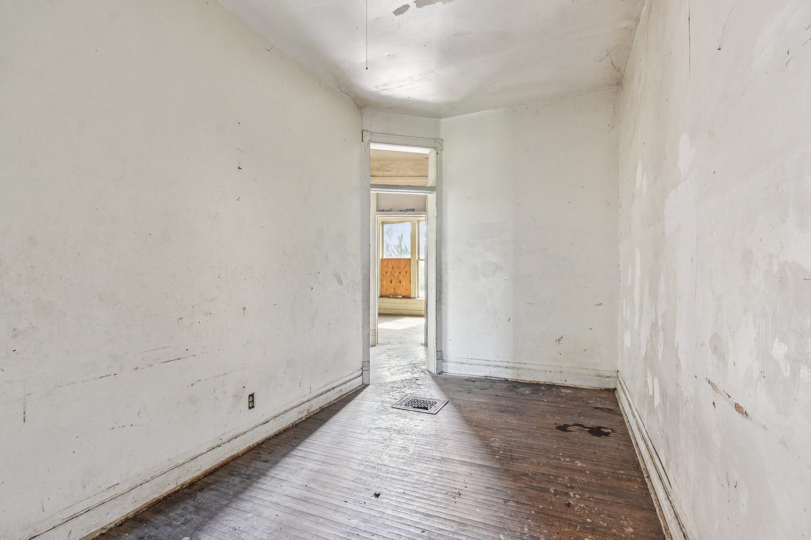 420 West 65th Place Chicago, IL 60621 - Photo 35 of 45 a view of an empty room with wooden floor