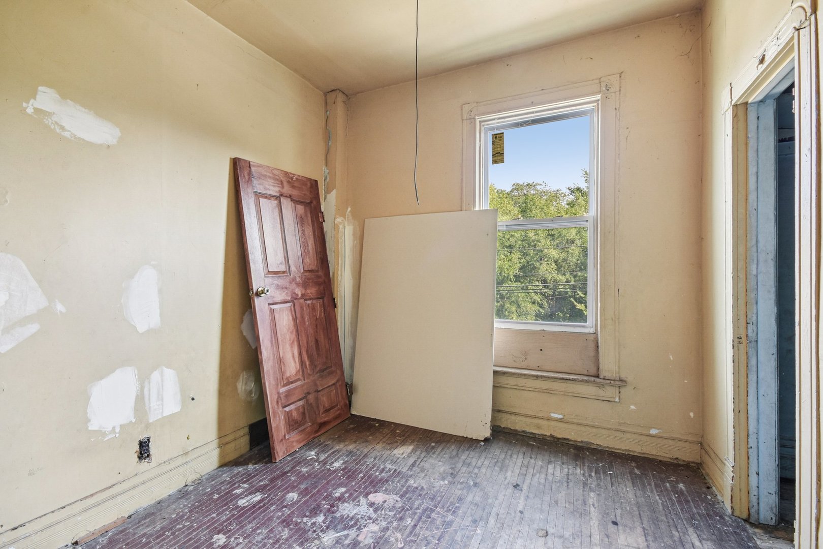 420 West 65th Place Chicago, IL 60621 - Photo 36 of 45 a view of front door with wooden floor