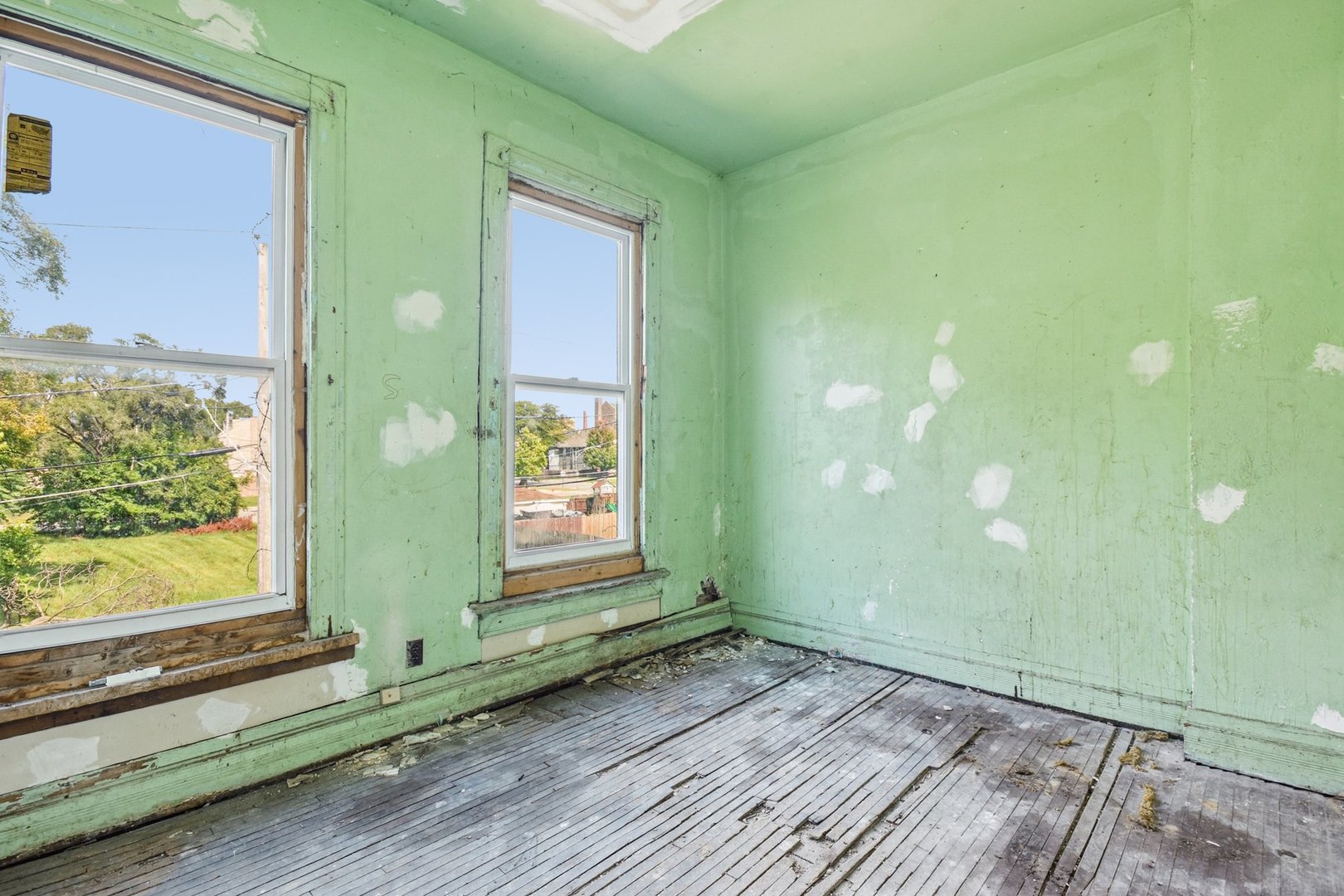 420 West 65th Place Chicago, IL 60621 - Photo 40 of 45 a view of a room that has a window and wooden floor