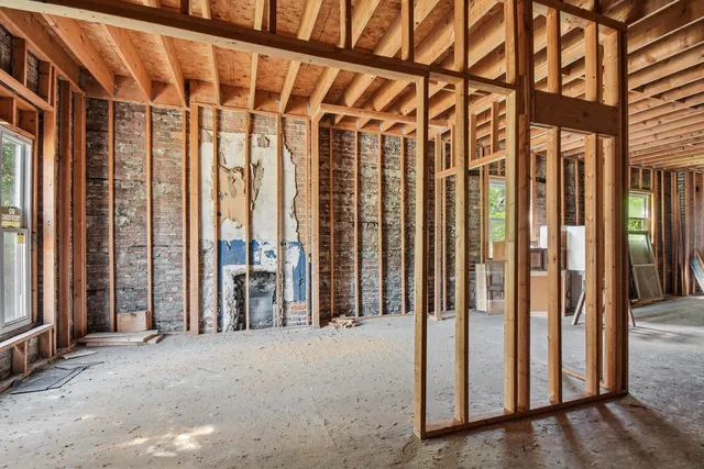 a view of an empty room with stairs