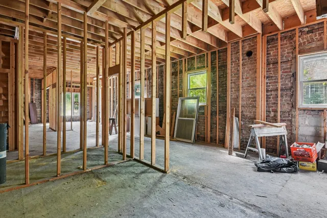 a view of entryway with wooden door