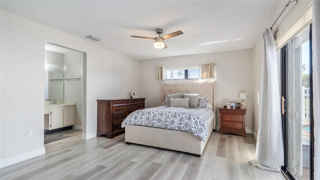 16932 Southwest 5th Way Weston, FL 33326 - Photo 6 of 49 Spacious primary with large ensuite, lots of natural light and pool access.