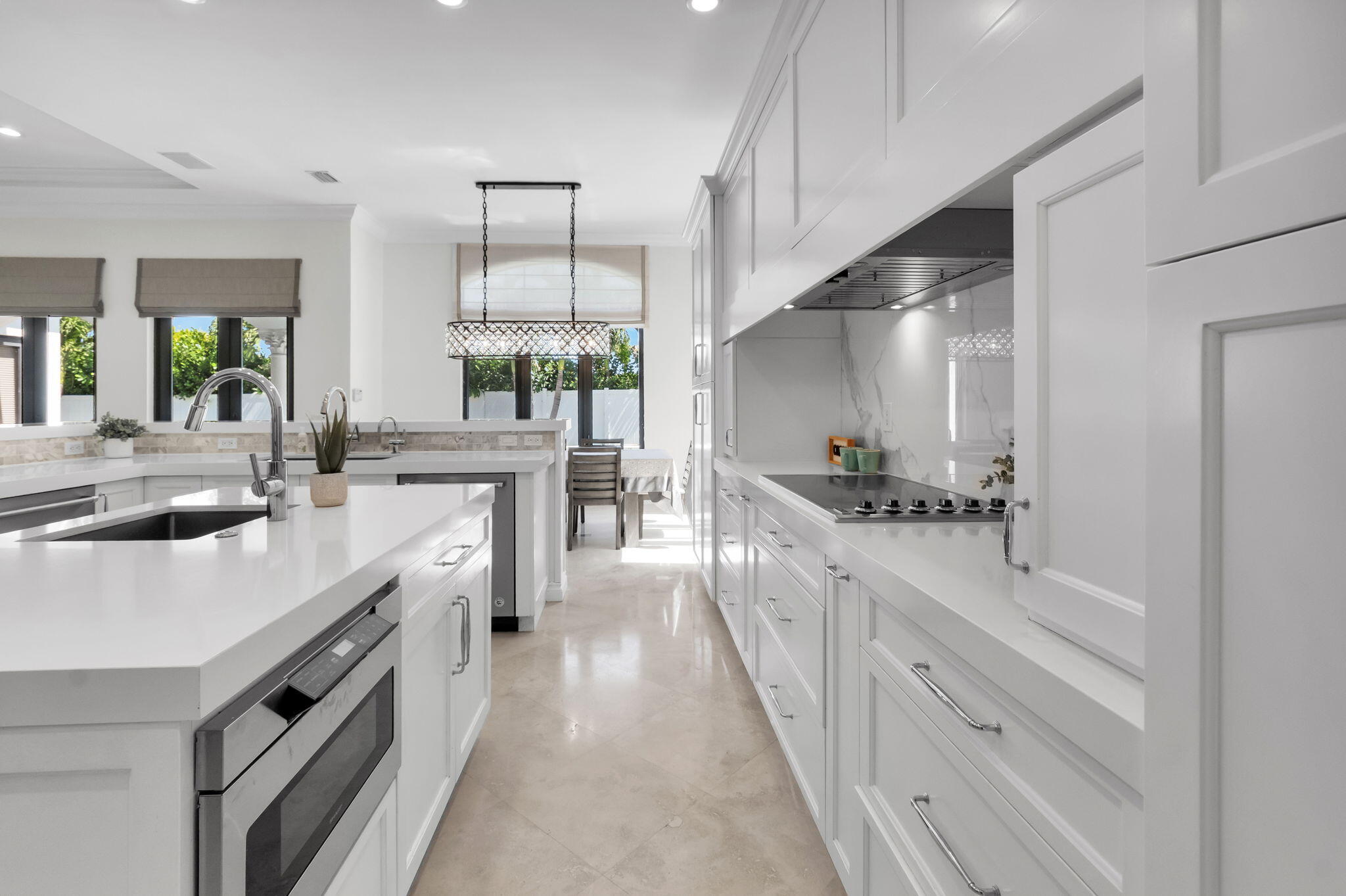 22175 Larkspur Trail Boca Raton, FL 33433 - Photo 17 of 40 a large white kitchen with a large window