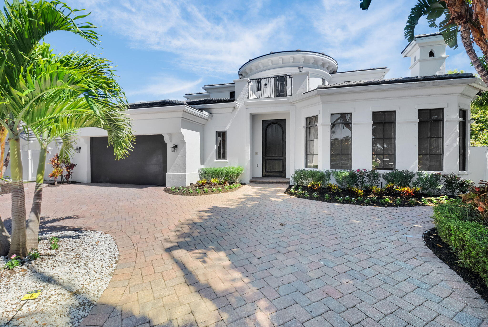 22175 Larkspur Trail Boca Raton, FL 33433 - Photo 2 of 40 a front view of a house with a yard
