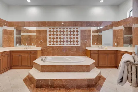 a spacious bedroom with a bed and window