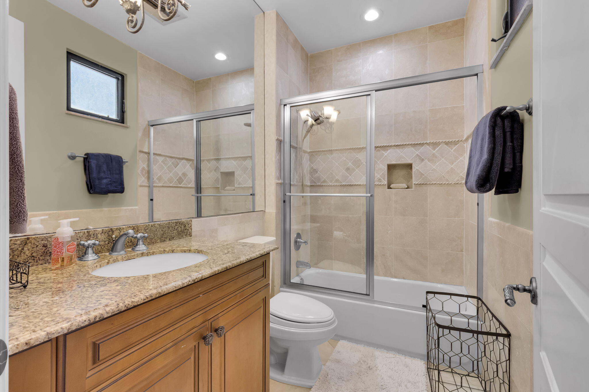22175 Larkspur Trail Boca Raton, FL 33433 - Photo 34 of 40 a bathroom with a granite countertop sink a toilet and shower