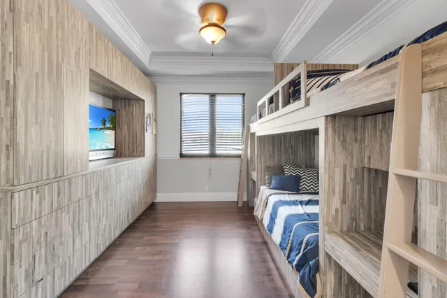 a view of a hallway with furniture and chandelier