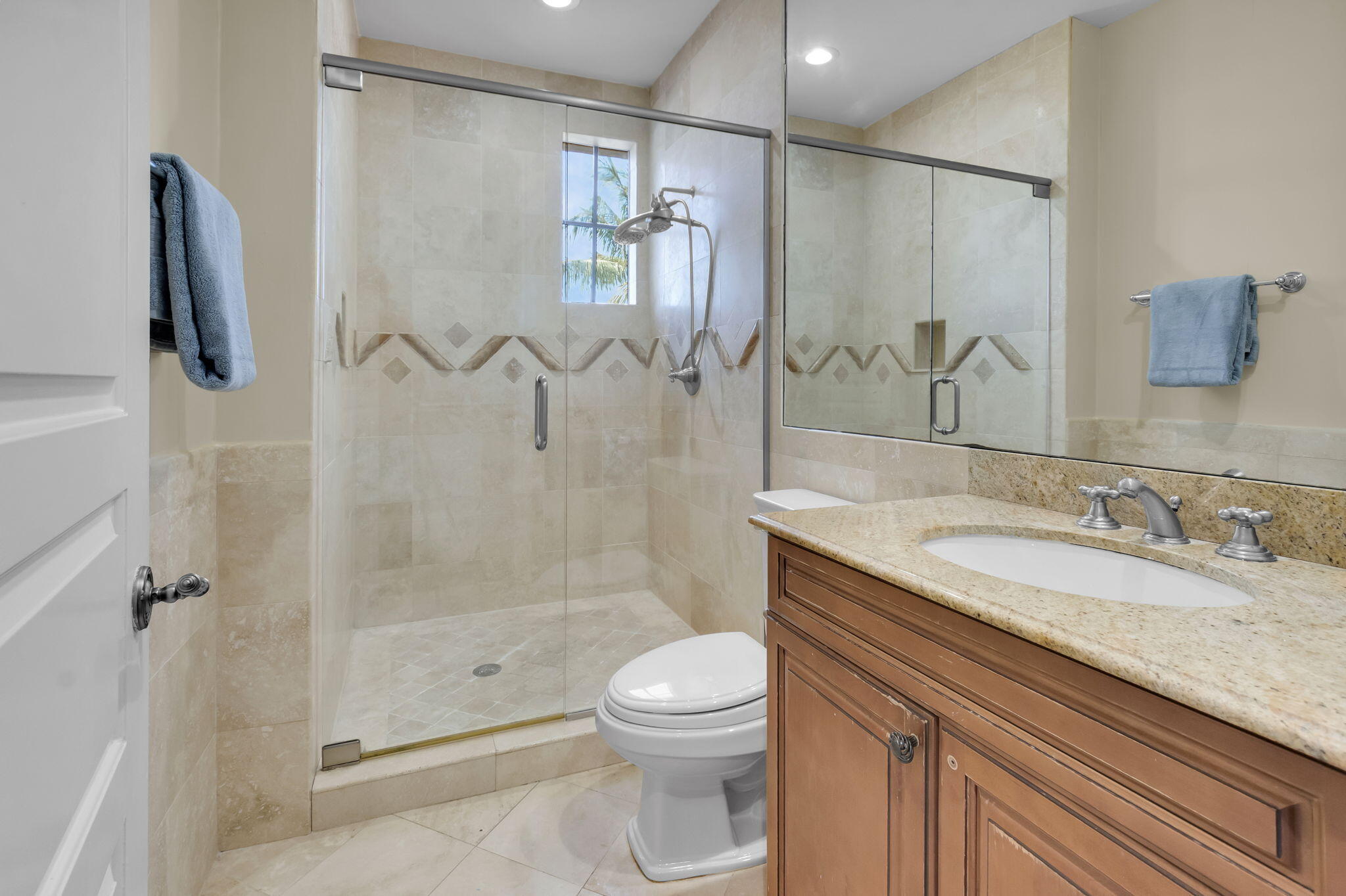 22175 Larkspur Trail Boca Raton, FL 33433 - Photo 36 of 40 a bathroom with a granite countertop sink a toilet and shower