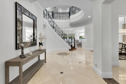 a view of entryway and hall with a front door