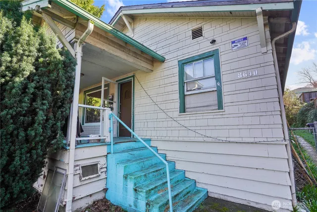a front view of a house with stairs