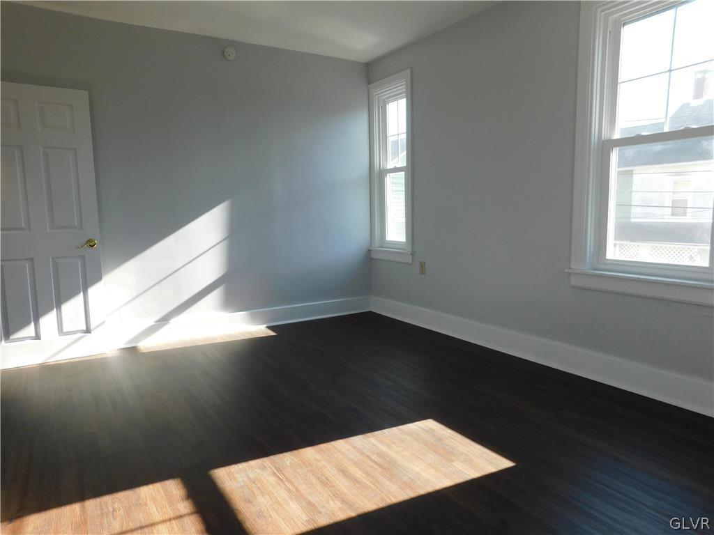 213 Penn Street Bath, PA 18014 - Photo 12 of 35 a close view of wooden floor and windows in a room