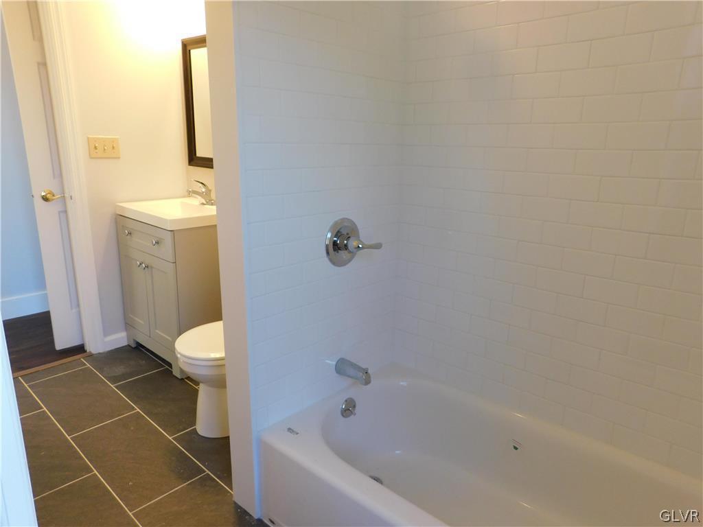 213 Penn Street Bath, PA 18014 - Photo 15 of 35 a bathroom with a bathtub and toilet