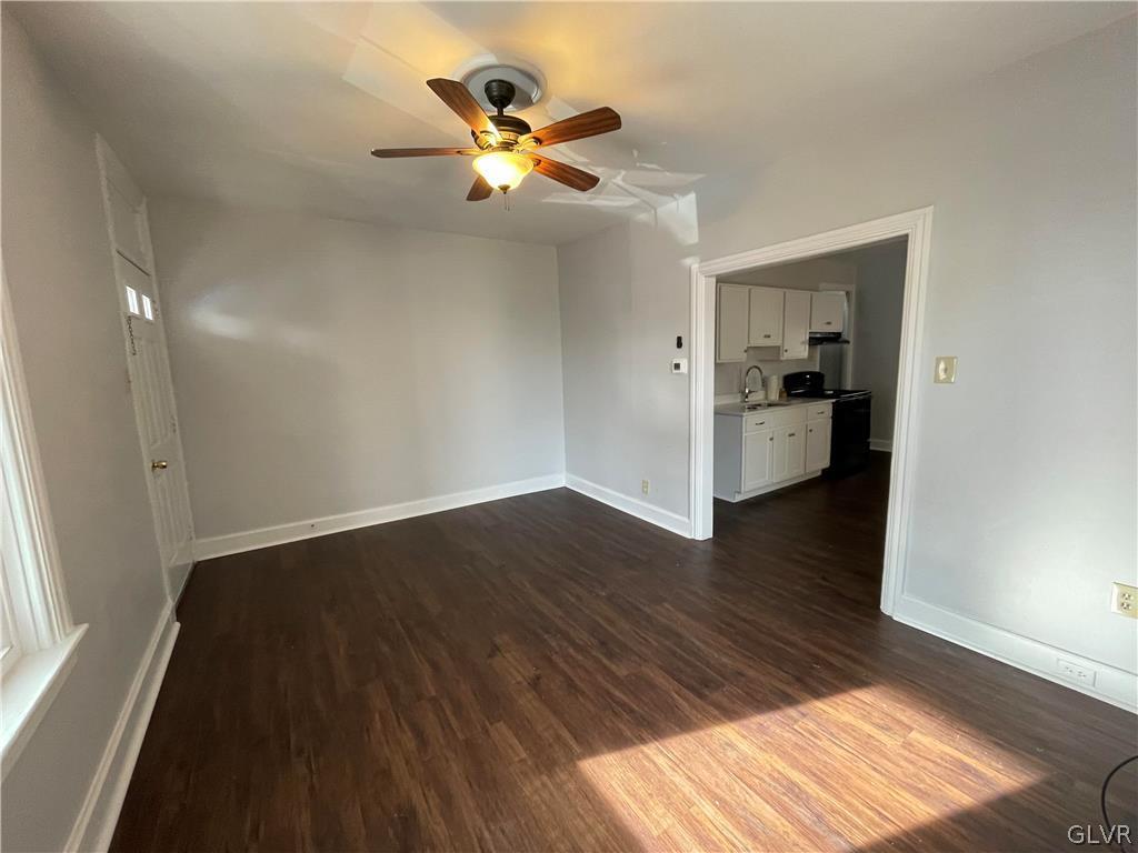 213 Penn Street Bath, PA 18014 - Photo 19 of 35 a view of a livingroom with wooden floor and a ceiling fan