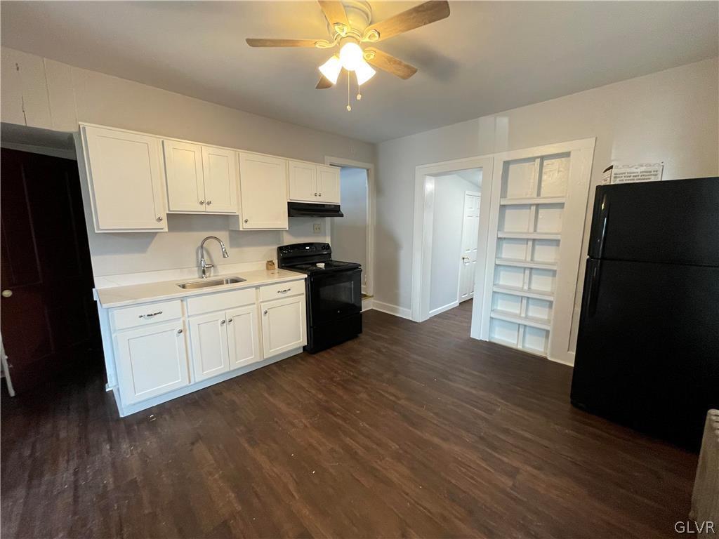 213 Penn Street Bath, PA 18014 - Photo 21 of 35 a kitchen with stainless steel appliances a refrigerator sink and cabinets