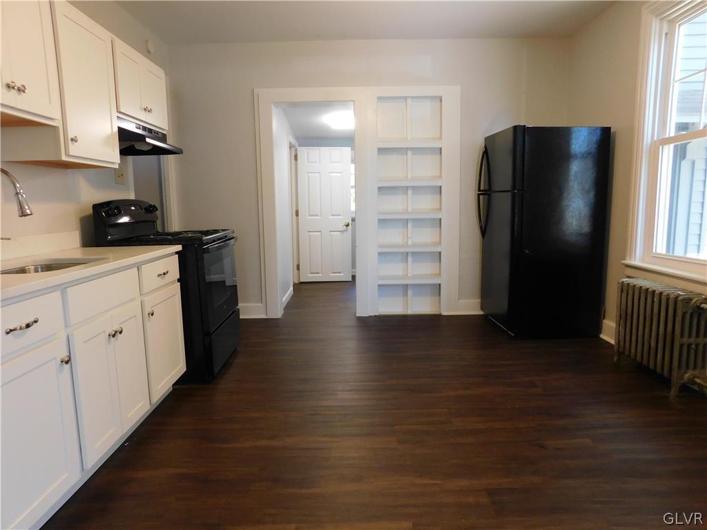 213 Penn Street Bath, PA 18014 - Photo 23 of 35 a kitchen with stainless steel appliances a refrigerator and a sink