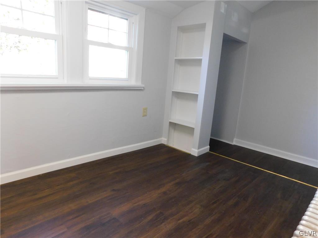 213 Penn Street Bath, PA 18014 - Photo 24 of 35 an empty room with wooden floor and windows