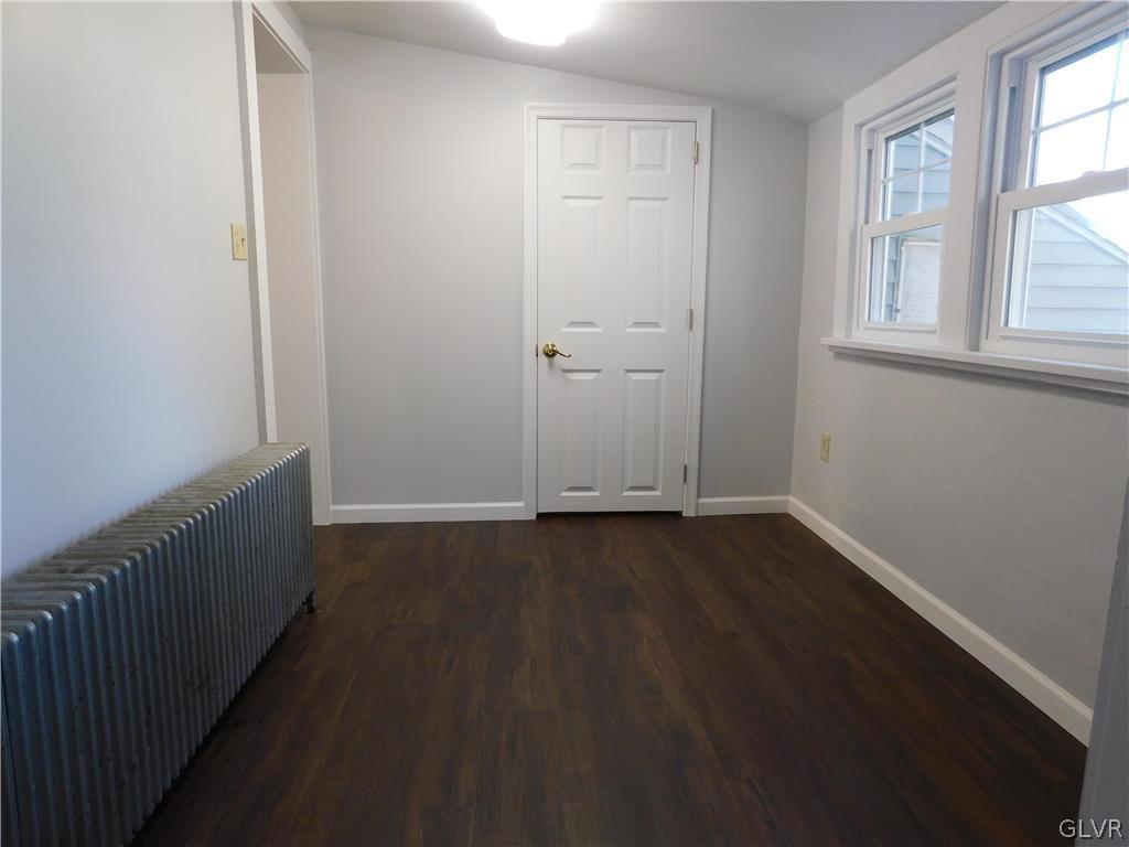 213 Penn Street Bath, PA 18014 - Photo 25 of 35 an empty room with wooden floor and windows
