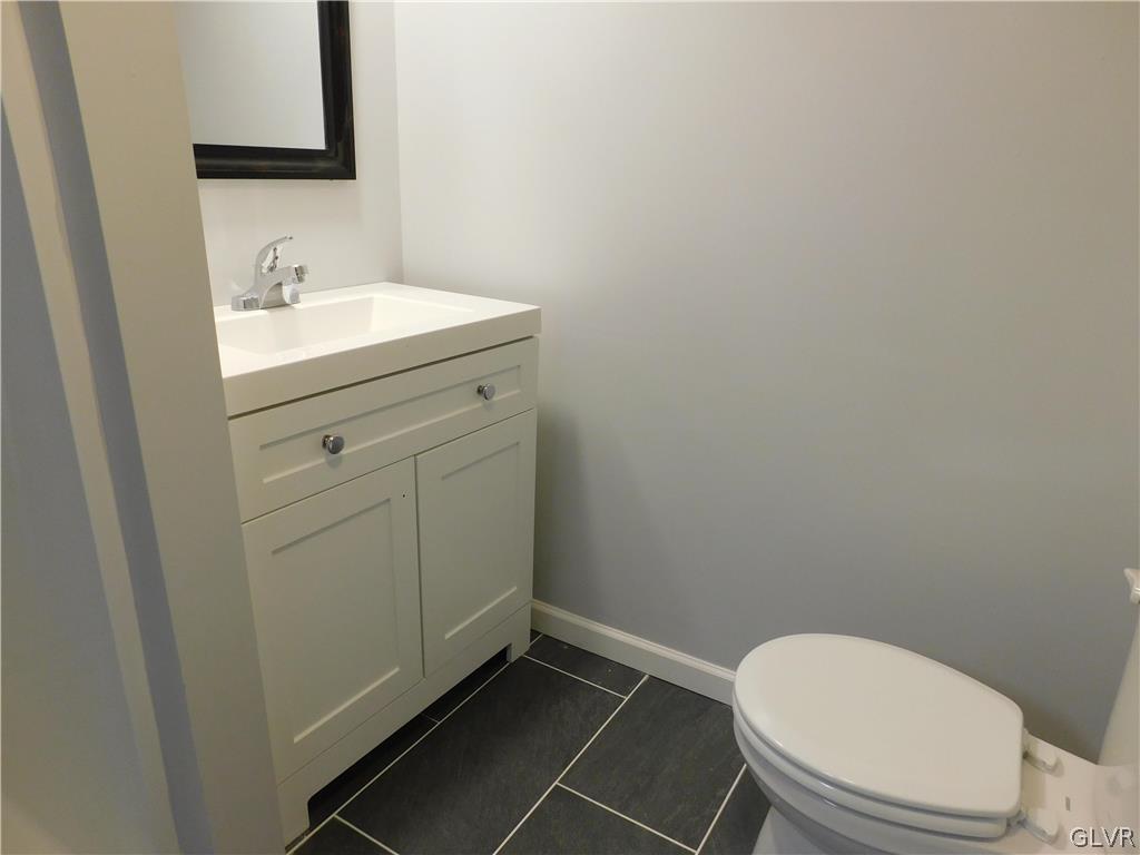 213 Penn Street Bath, PA 18014 - Photo 26 of 35 a bathroom with a toilet sink and mirror
