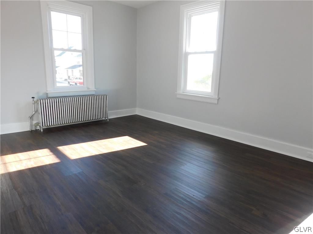 213 Penn Street Bath, PA 18014 - Photo 28 of 35 an empty room with wooden floor and windows