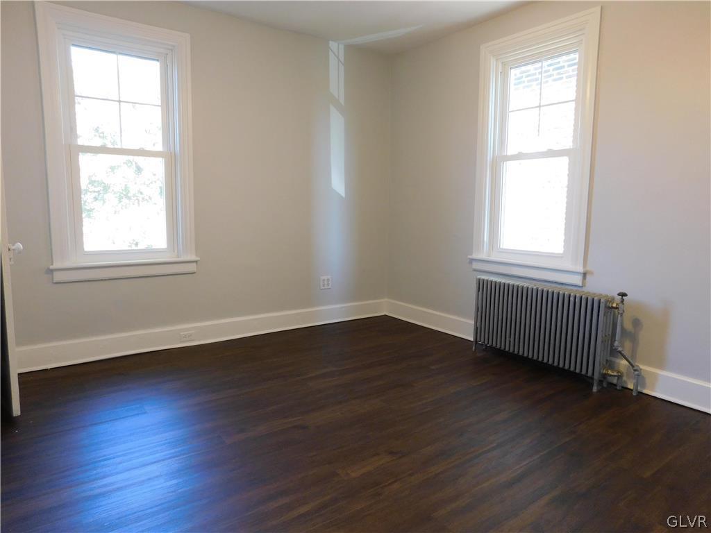 213 Penn Street Bath, PA 18014 - Photo 30 of 35 an empty room with wooden floor and windows