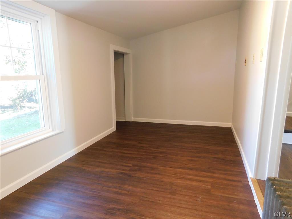 213 Penn Street Bath, PA 18014 - Photo 9 of 35 an empty room with wooden floor and windows