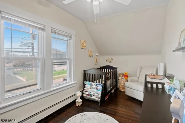 a bathroom with a toilet a sink and a mirror