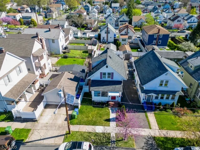 an aerial view of a houses with yard