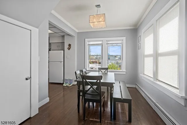a kitchen with cabinets appliances a sink and a window