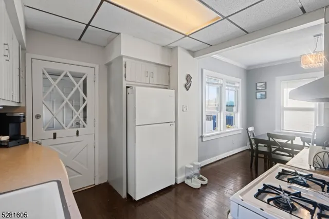 a reading room with furniture and wooden floor