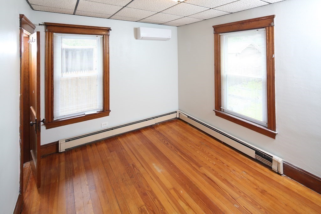 137 Mendon Road Attleboro, MA 02703 - Photo 12 of 24 a view of an empty room with wooden floor and a window