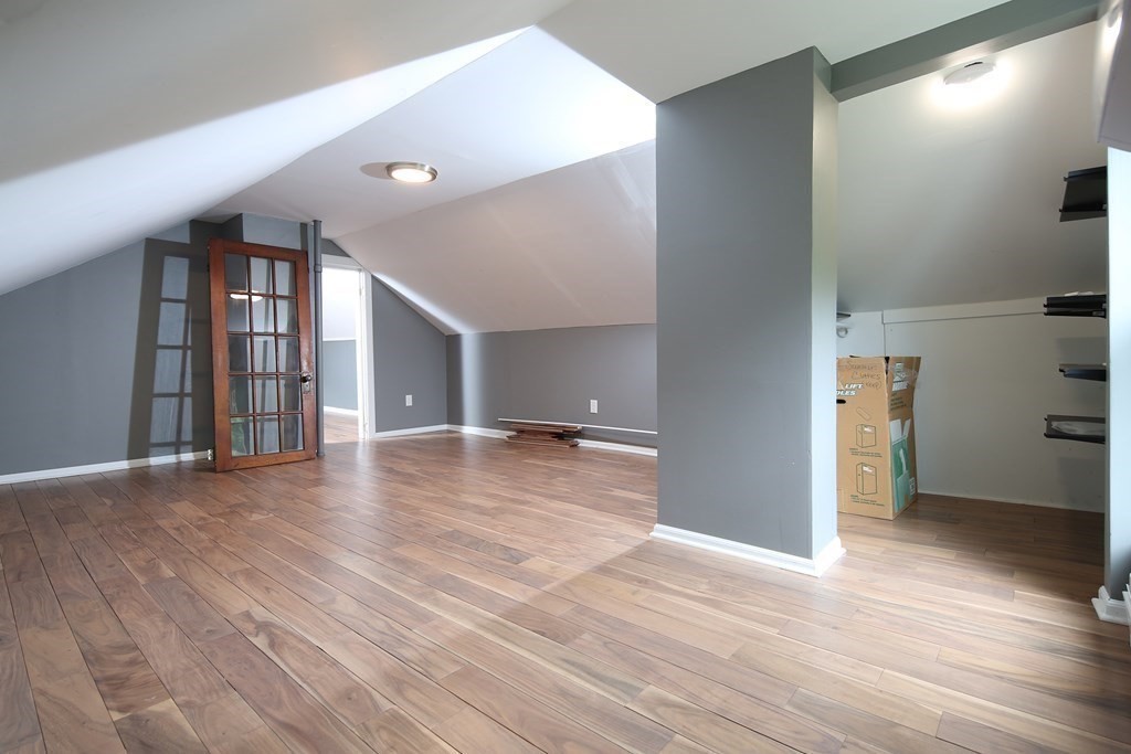 137 Mendon Road Attleboro, MA 02703 - Photo 13 of 24 a view of a livingroom with wooden floor and staircase