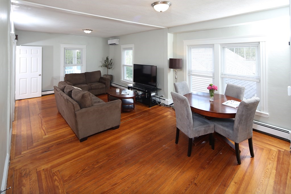 137 Mendon Road Attleboro, MA 02703 - Photo 2 of 24 a living room with furniture and a flat screen tv