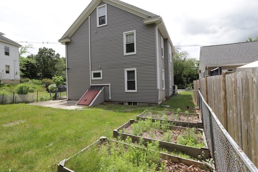 137 Mendon Road Attleboro, MA 02703 - Photo 21 of 24 a view of backyard with a patio and a garden